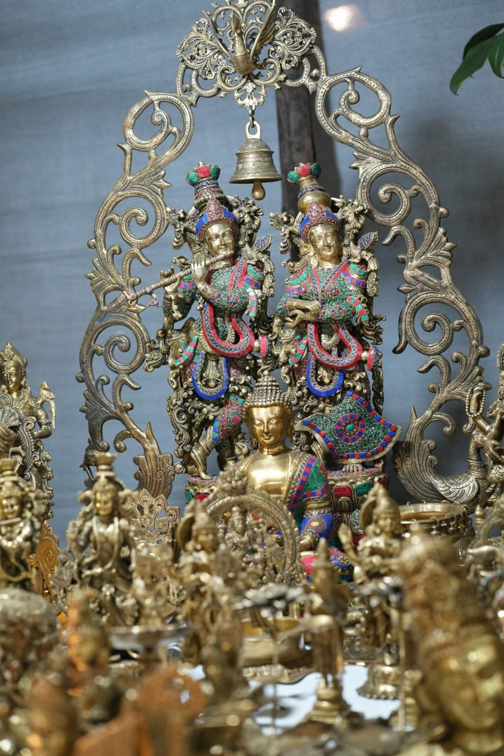 Ornate brass deity statues in a shrine